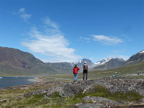 Michael Marks and Gregor Markl admiring the distant Greenland Minerals and Energy deposit at Kvanefjeld, from the town of Narsaq.