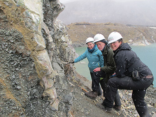 Participants (L to R) E. Deady, G. Gunn (both BGS) and H. Elliott (CSM) admiring fenite in the snow at Ledmore Marble Quarry.
